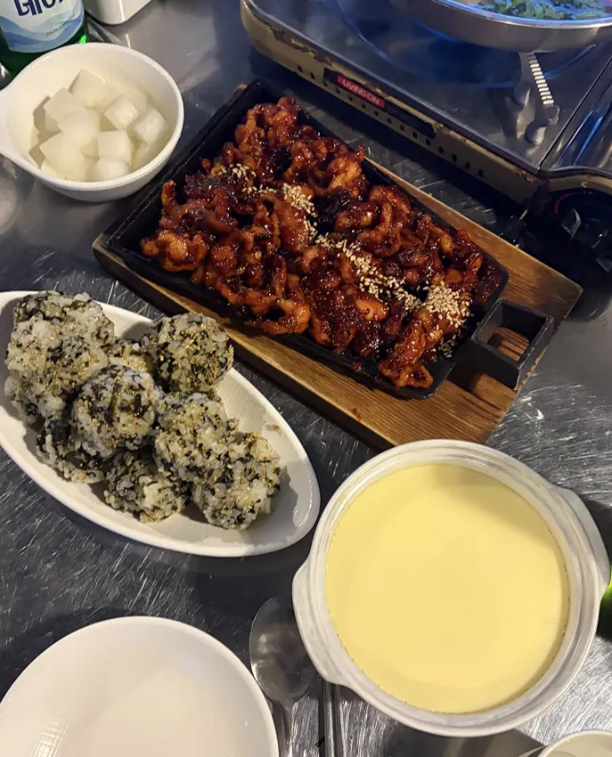Full spread with boneless dakbal and pudding-like steamed egg