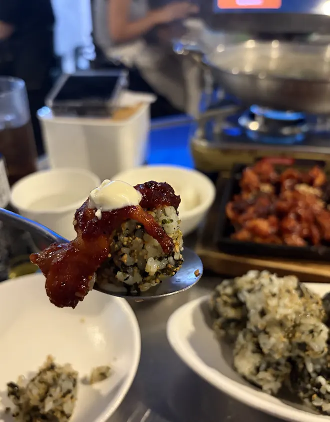A glass of soju enjoyed with dakbal