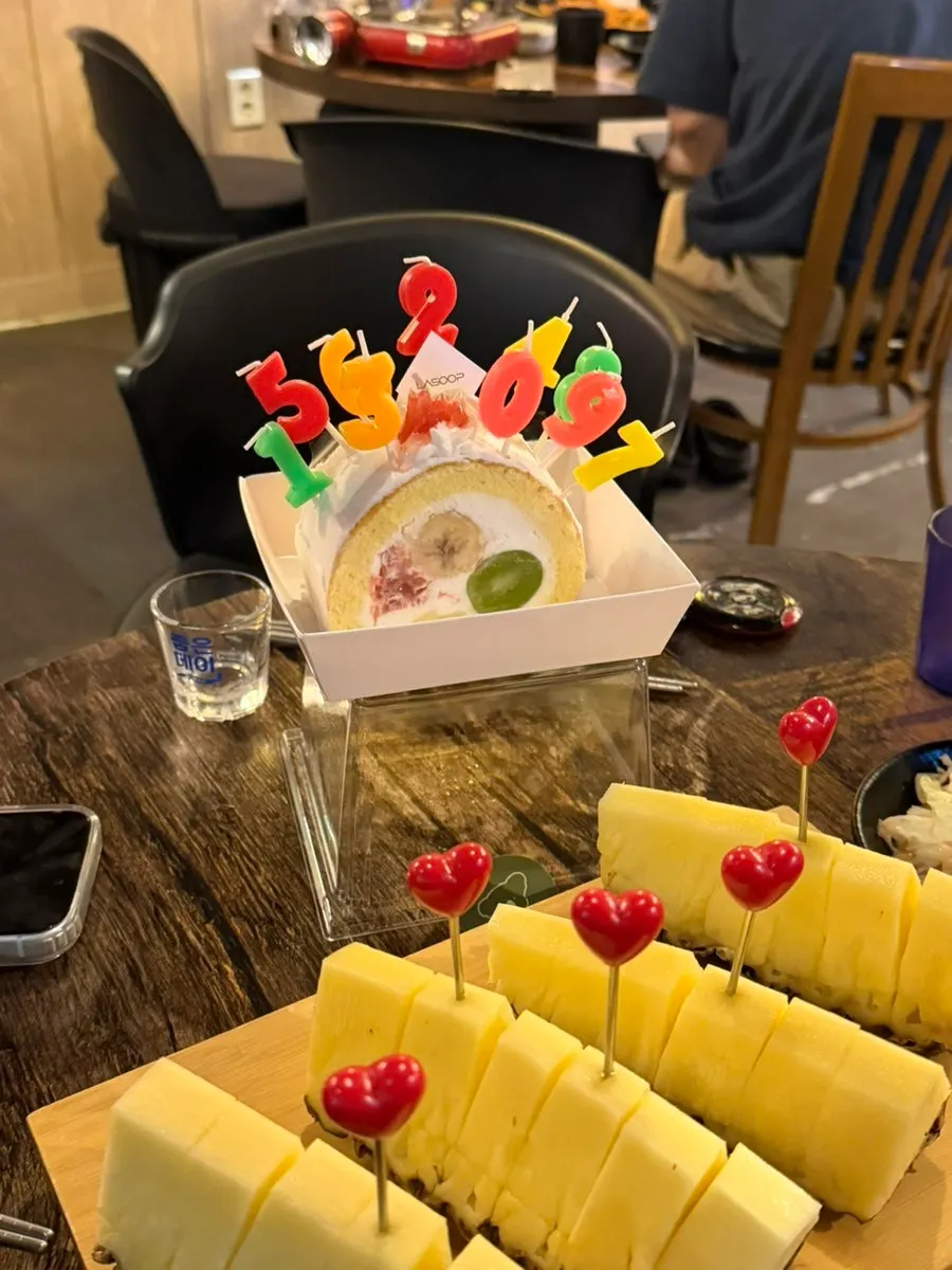 Half a pineapple with food for the gathering