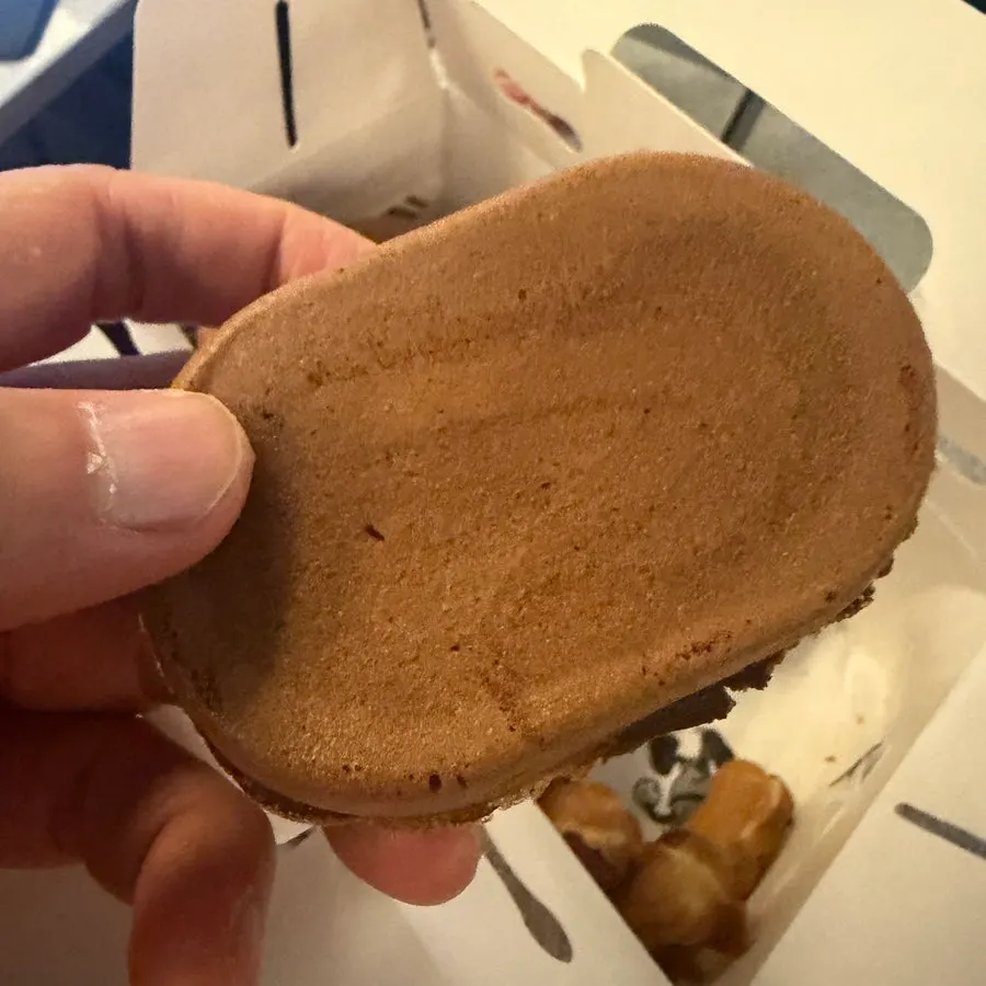 A bite taken out of the peanut bread on the train