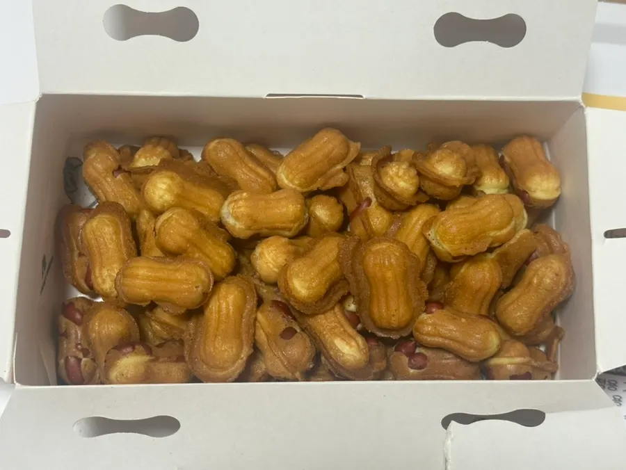 Box opened to reveal peanut bread filled to the top