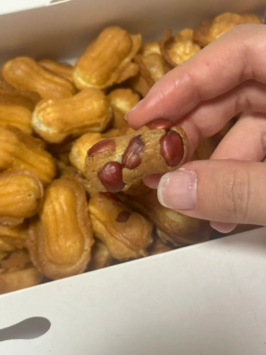Peanut bread split in half showing whole peanuts
