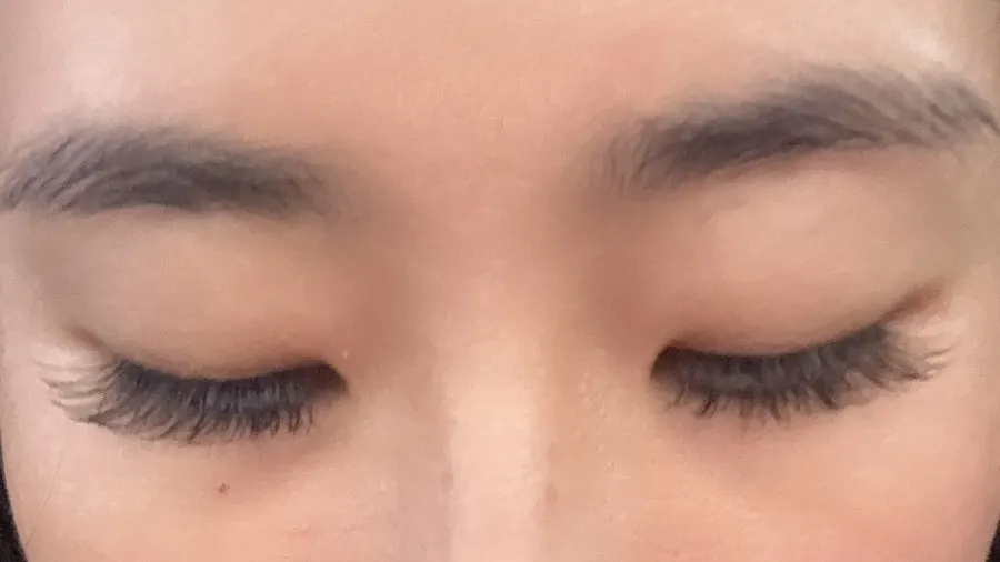 Finished eyelash extension result with a natural curl
