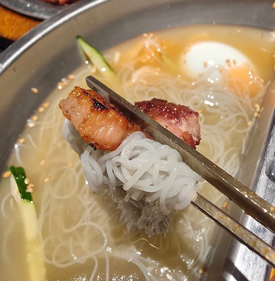 Half-and-half naengmyeon eaten with pork ribs