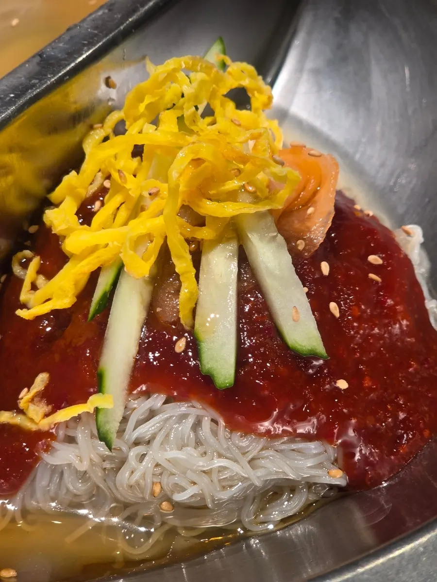 Half-and-half naengmyeon with mul- and bibim-style noodles