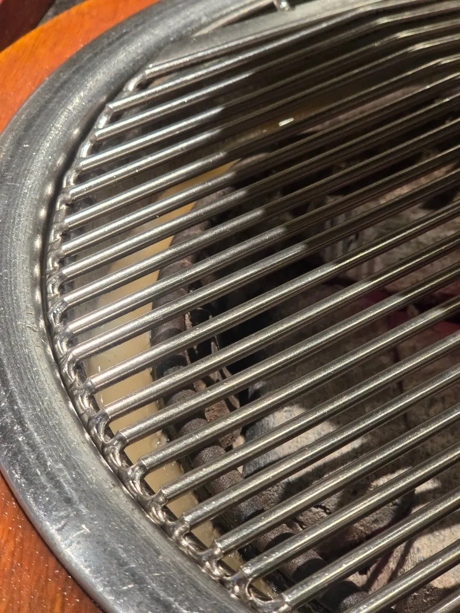 A freshly swapped grill plate before adding the marinated ribs