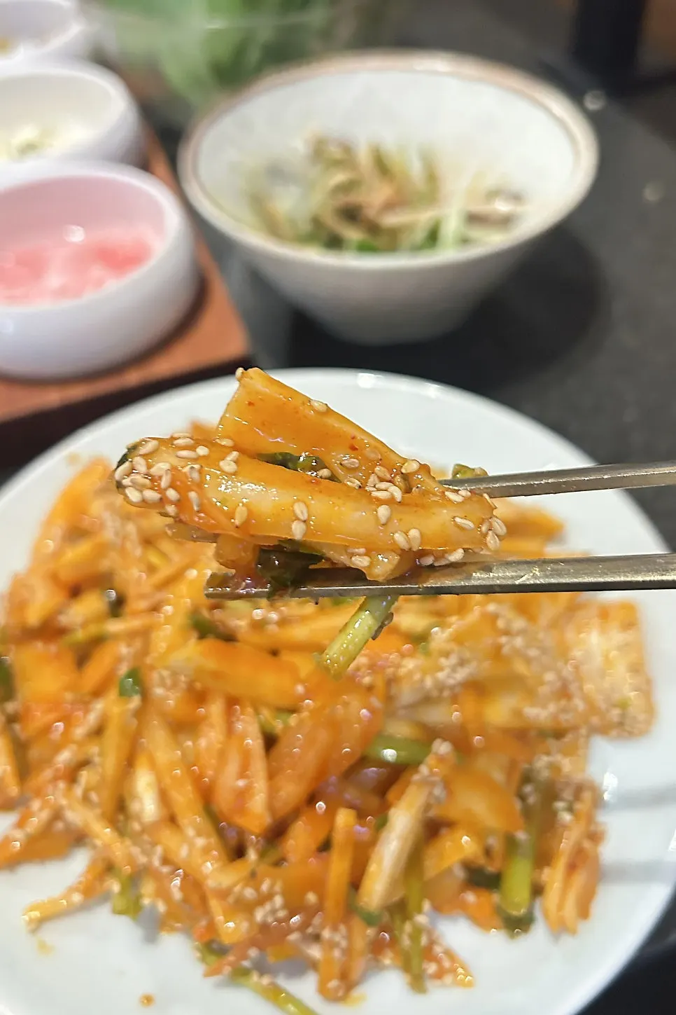 Doenjang stew served with a large uncut piece of tofu