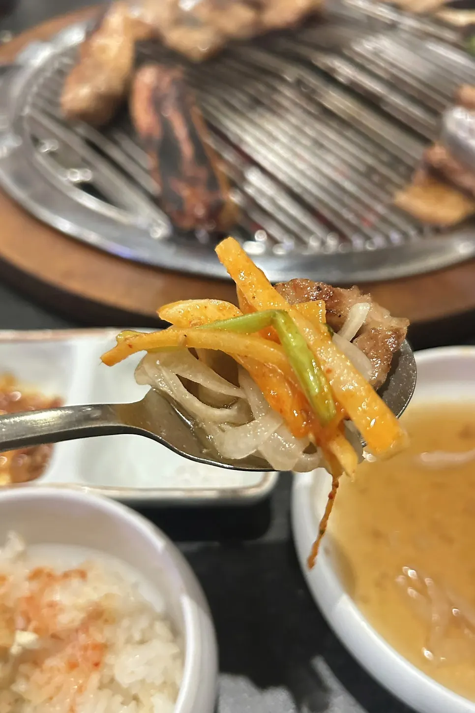 Marinated ribs and squid muchim in a lettuce wrap