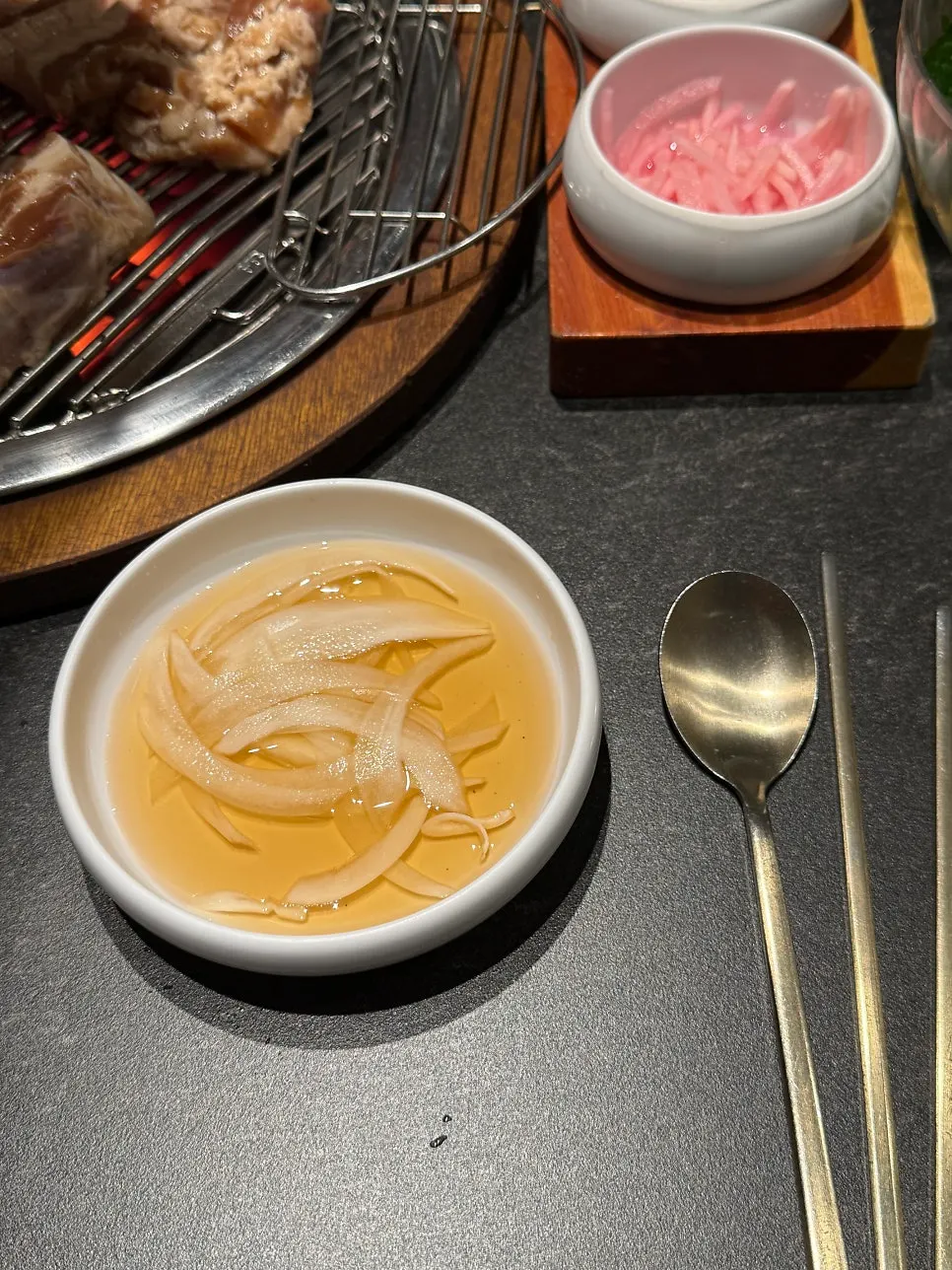Individual servings of pickled onion and wrap greens