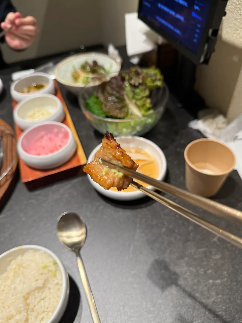 A piece of marinated rib topped with fresh wasabi