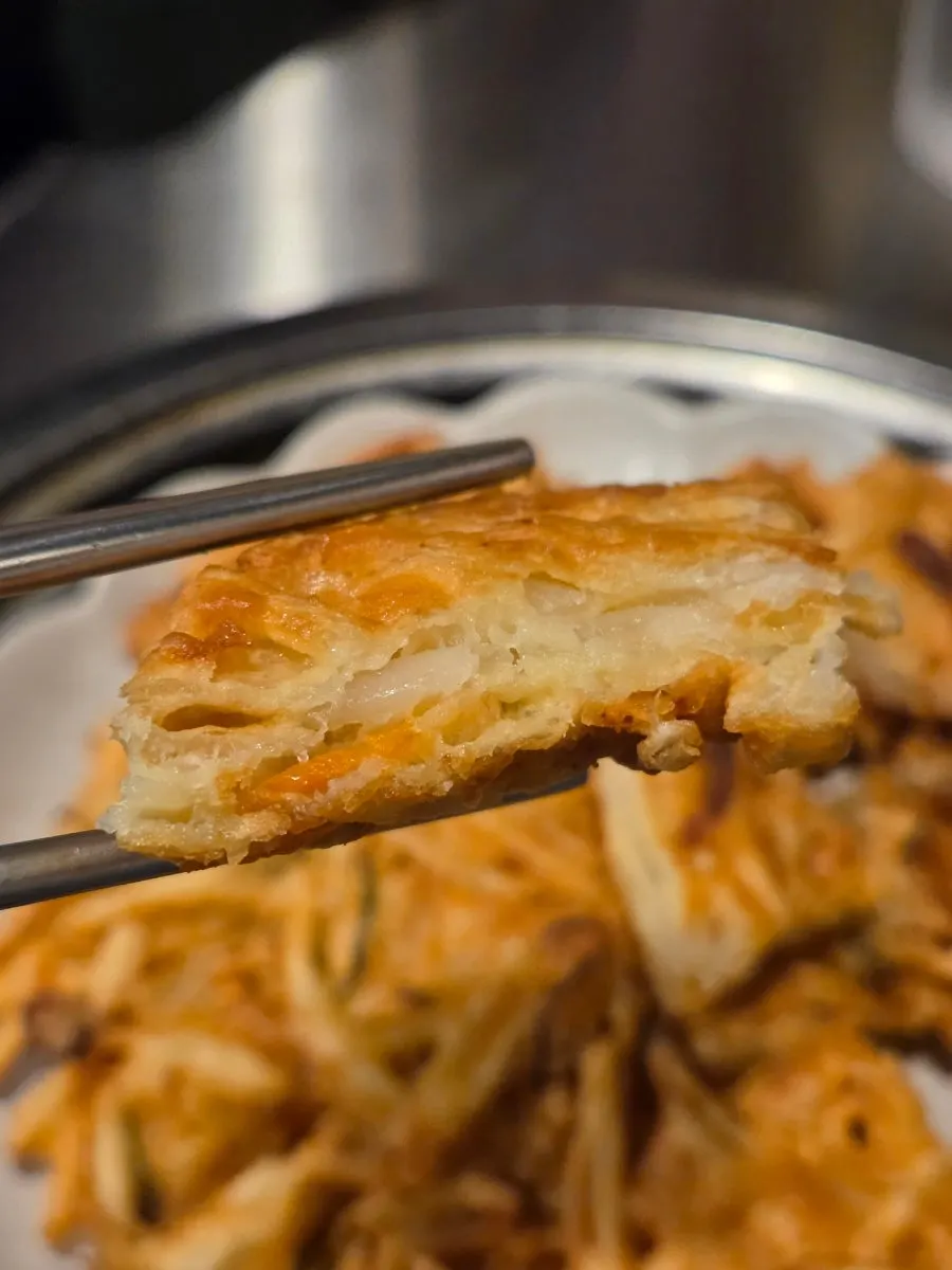 Large seafood potato pancake served at the table