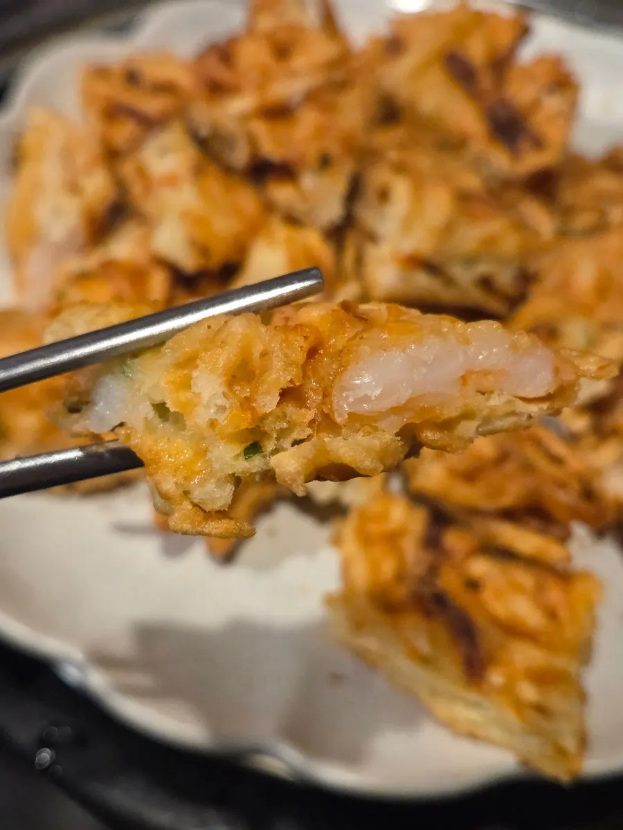 Cross-section of the golden-fried seafood potato pancake