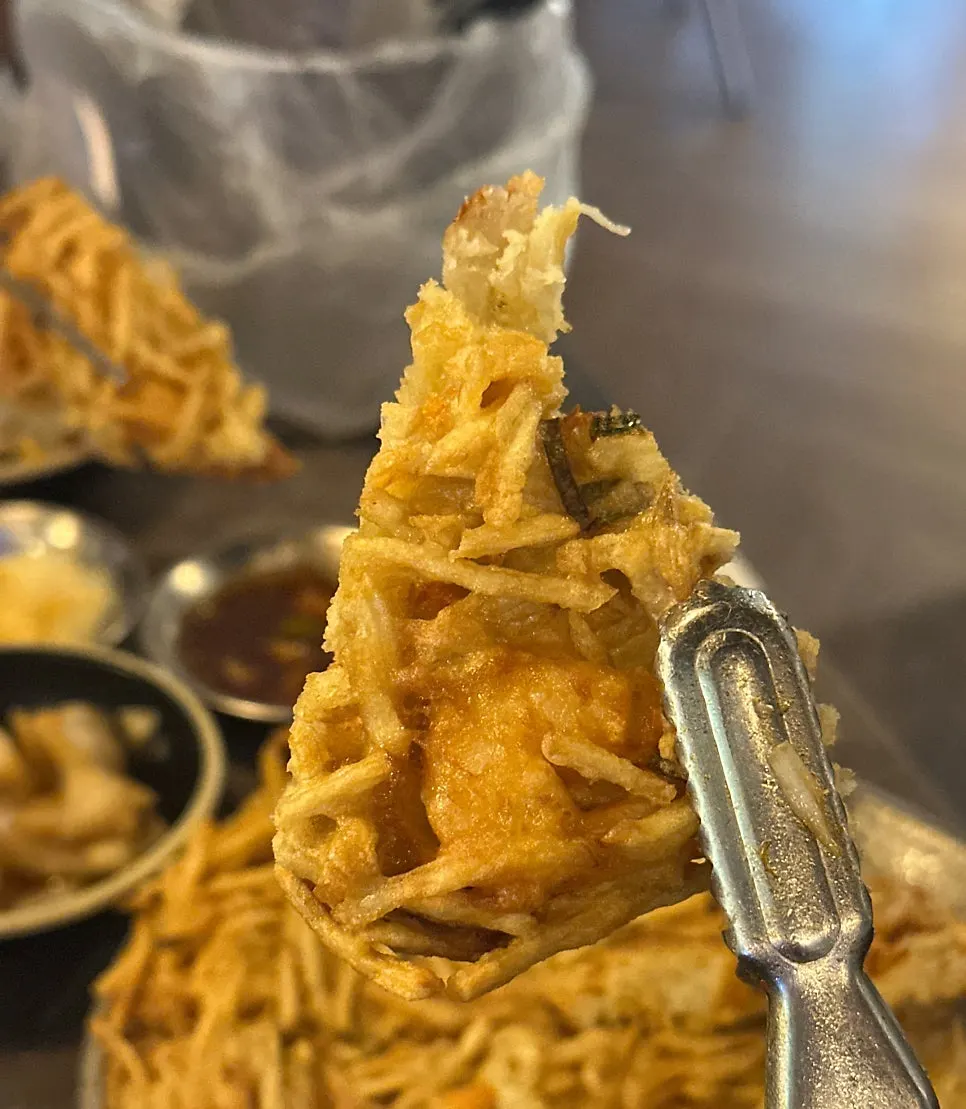 Makgeolli served alongside the seafood potato pancake