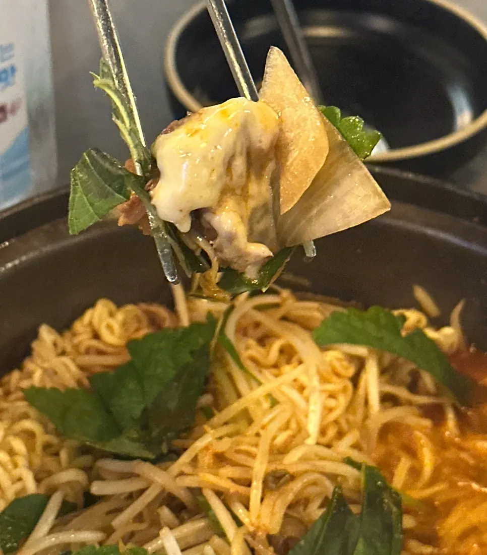 Perilla leaf topped with ribs and bean sprouts
