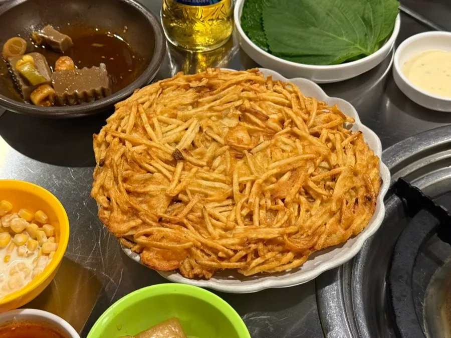 Basic banchan including soup, corn salad, and acorn jelly salad