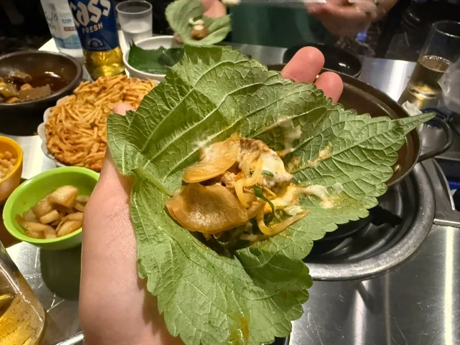 Spicy braised ribs with stretching cheese poured over