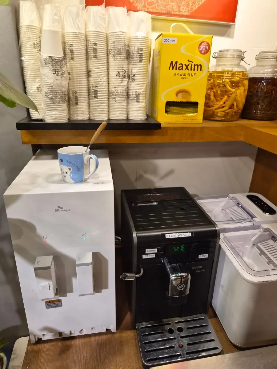 Self-serve side dishes and water station at Gang Galbitang