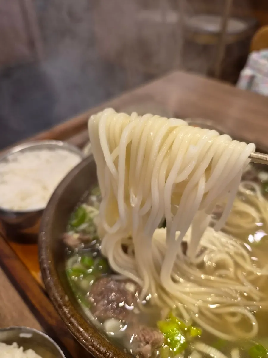 Mixing rice into the galbitang broth