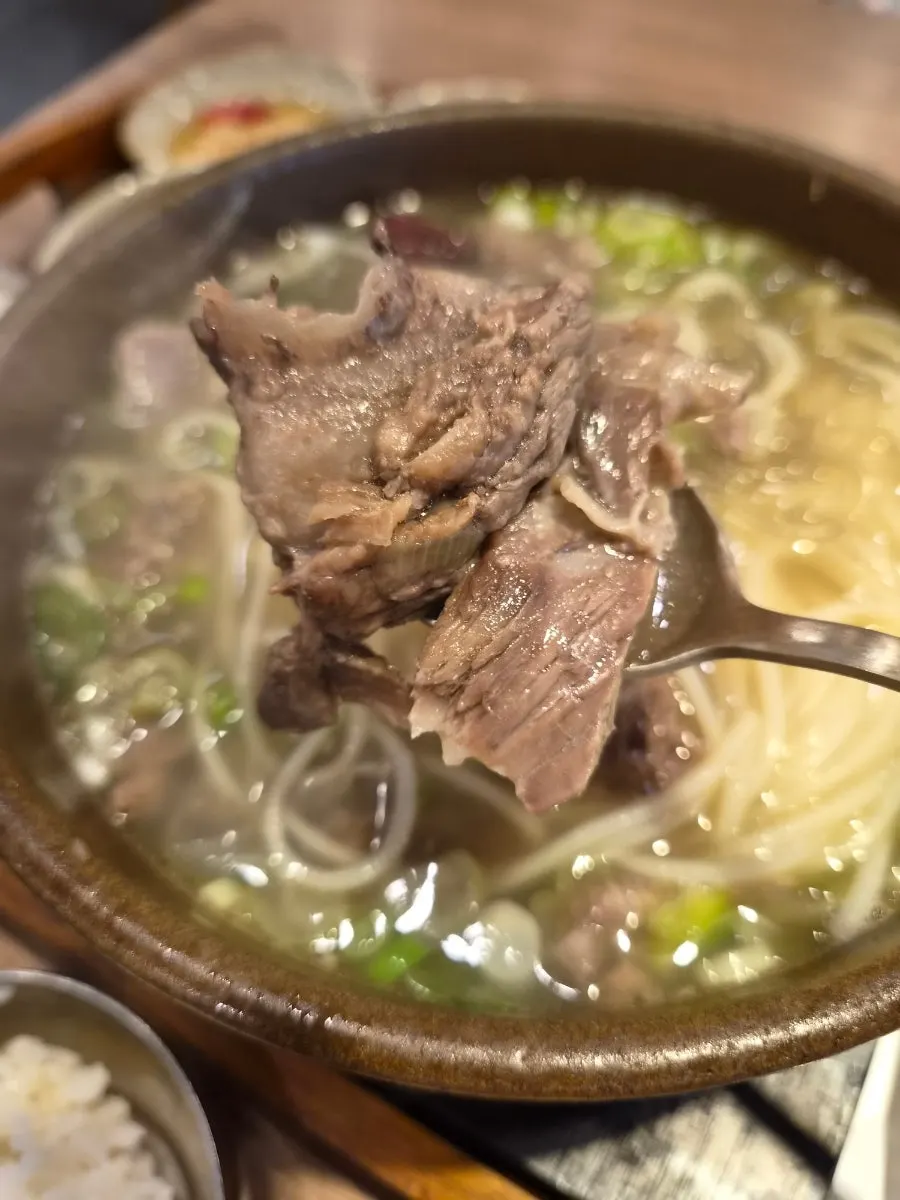 Finishing the gang galbitang with rice mixed in