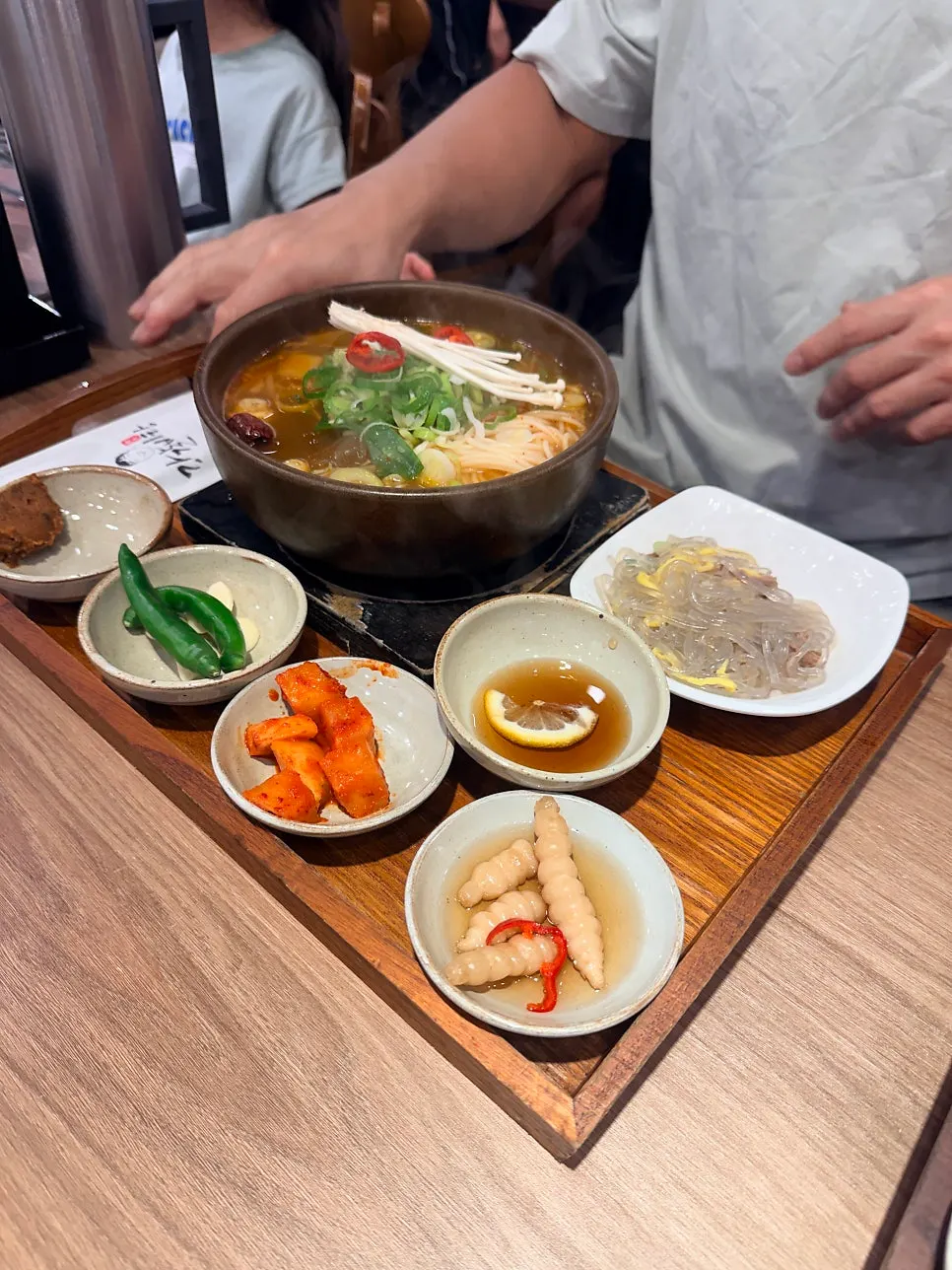 Broth and ingredients in spicy galbi gukbap