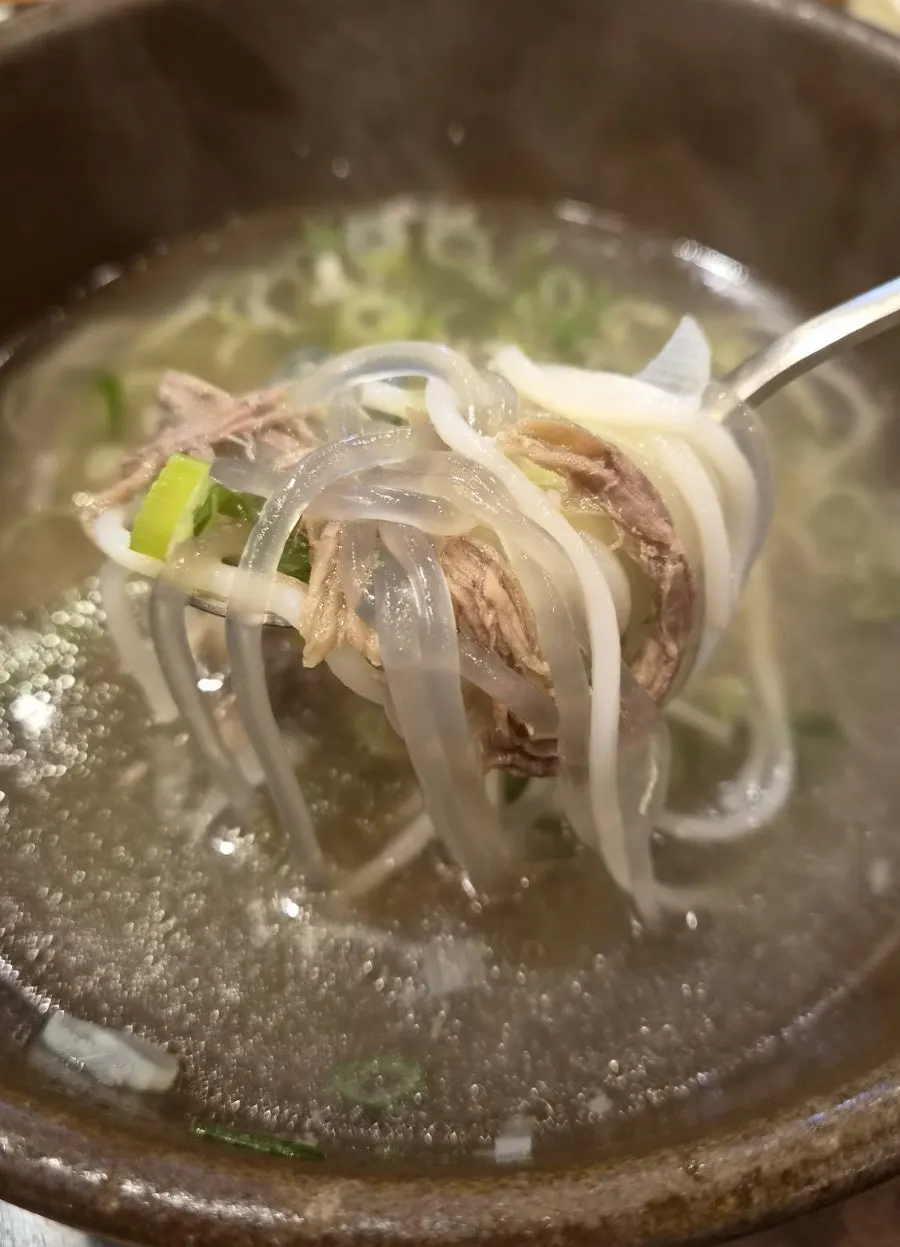 Glass noodles soaked in galbitang broth