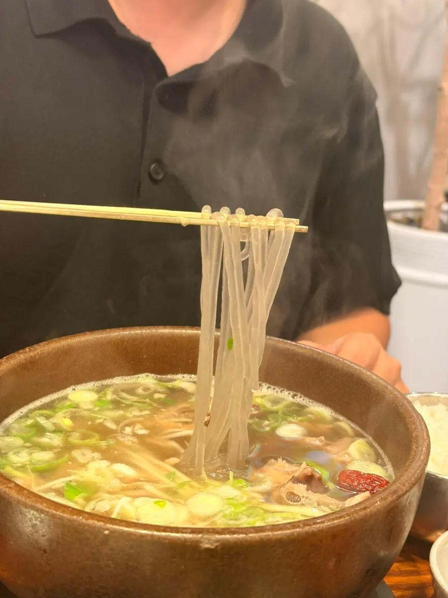 Wheat noodles and glass noodles inside the galbitang