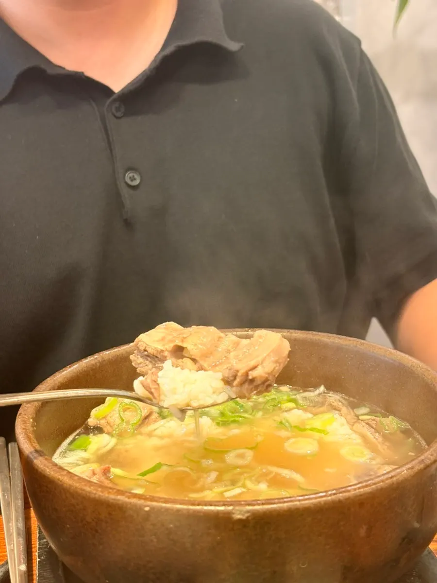 A spoonful of rice topped with meat from the galbitang