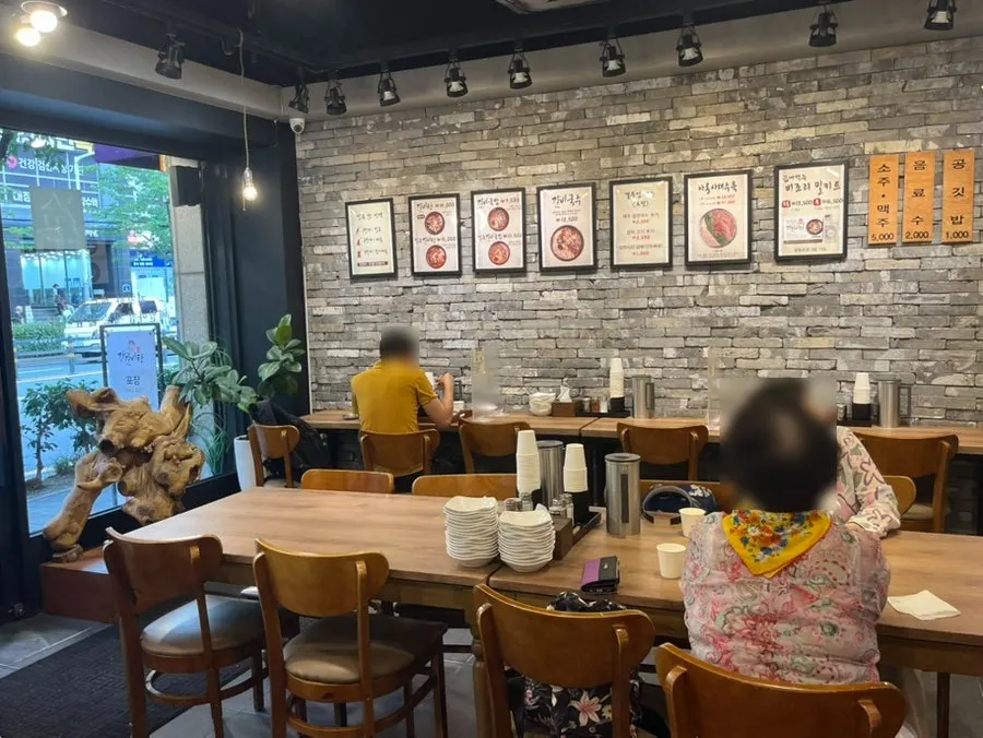 Restaurant interior with a straight bar table along the wall