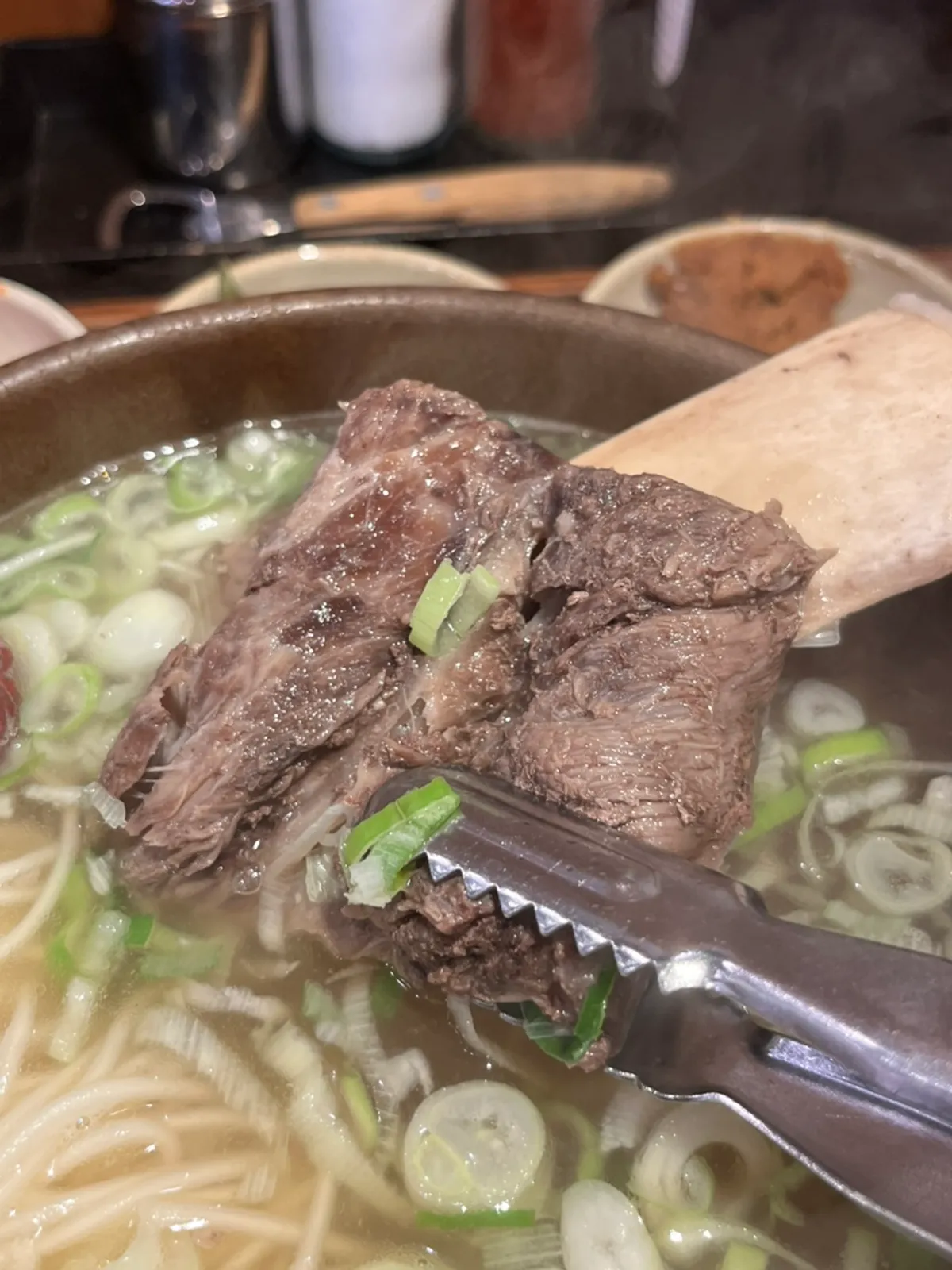 A tender rib bone picked up from the soup