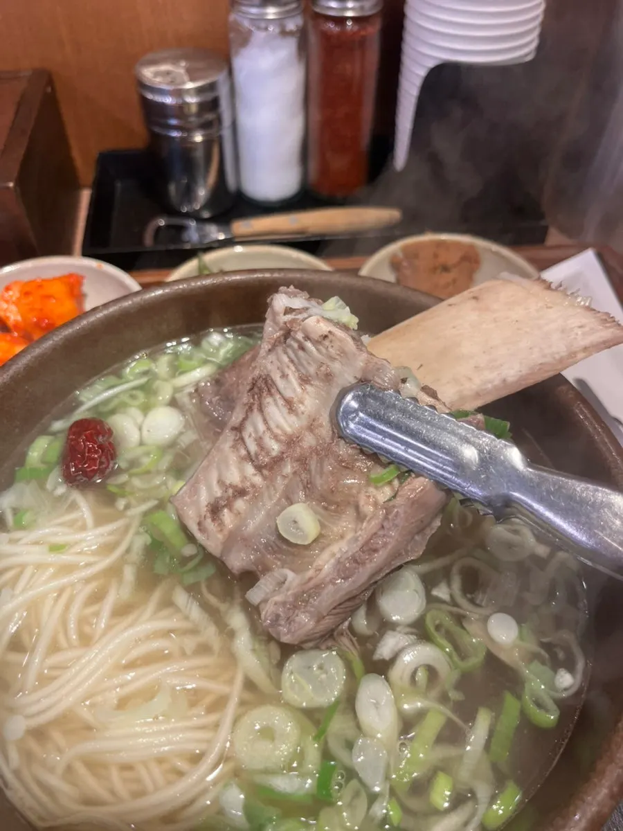 Three large rib bones in the broth