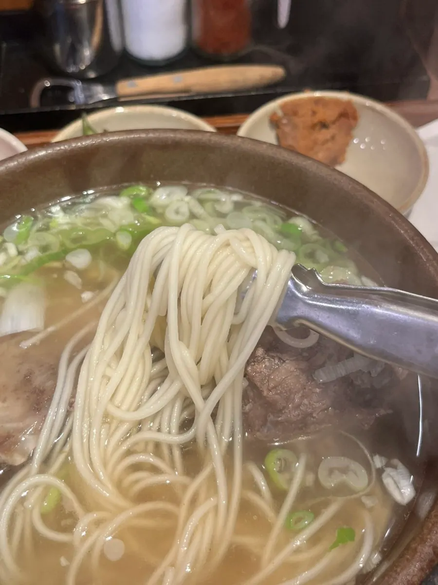 Jeju jungmyeon noodles added to the broth