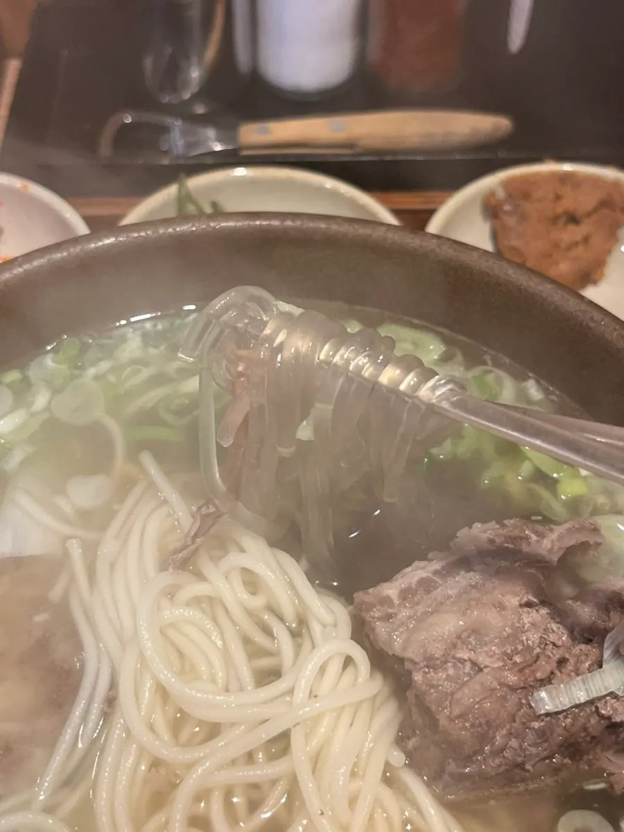 Chewy jungmyeon noodles lifted up