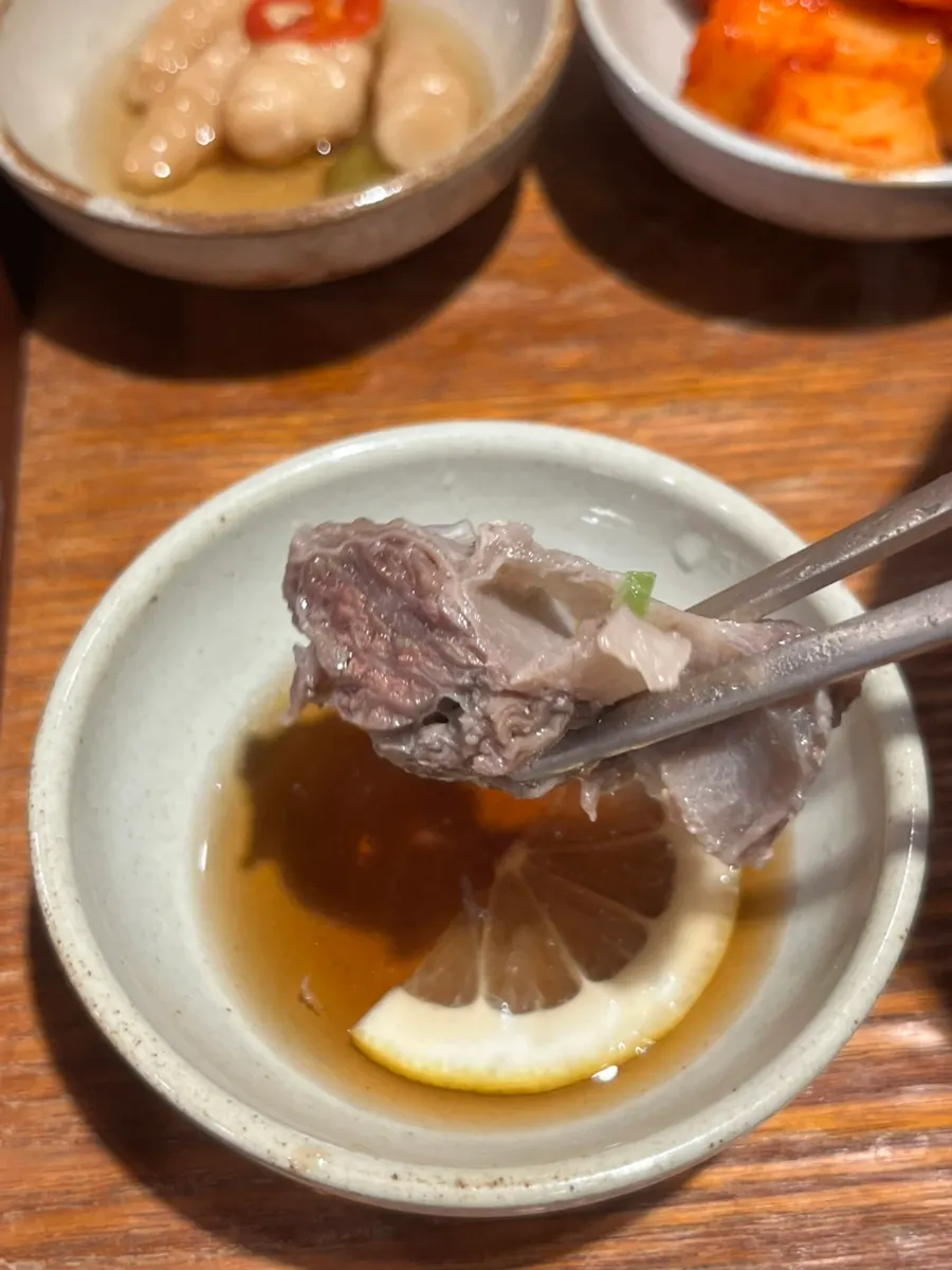 Meat still remaining in a nearly empty galbitang bowl