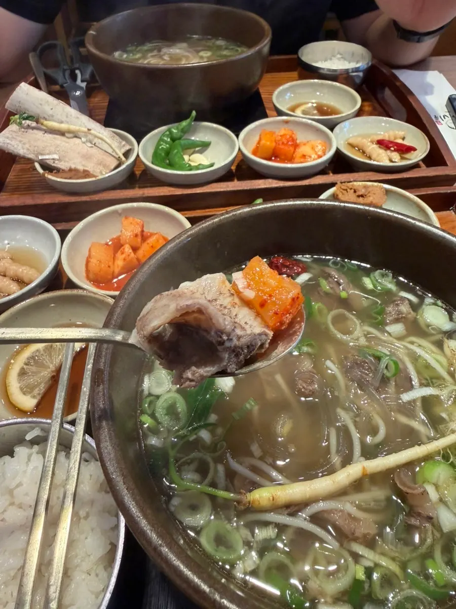 Chopsticks holding rib meat and kkakdugi together