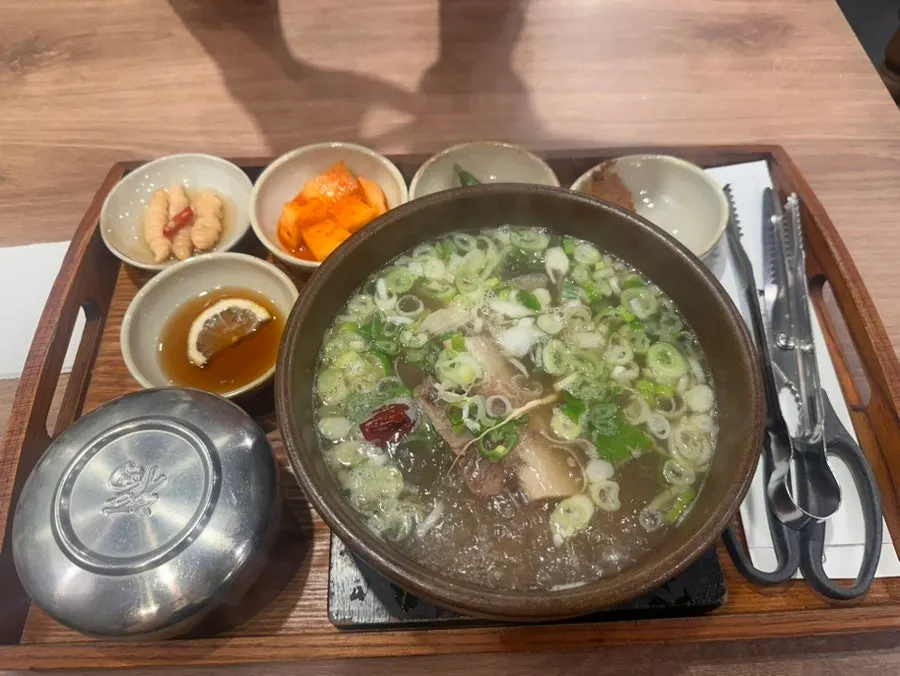 A full spread of galbitang and spicy galbitang