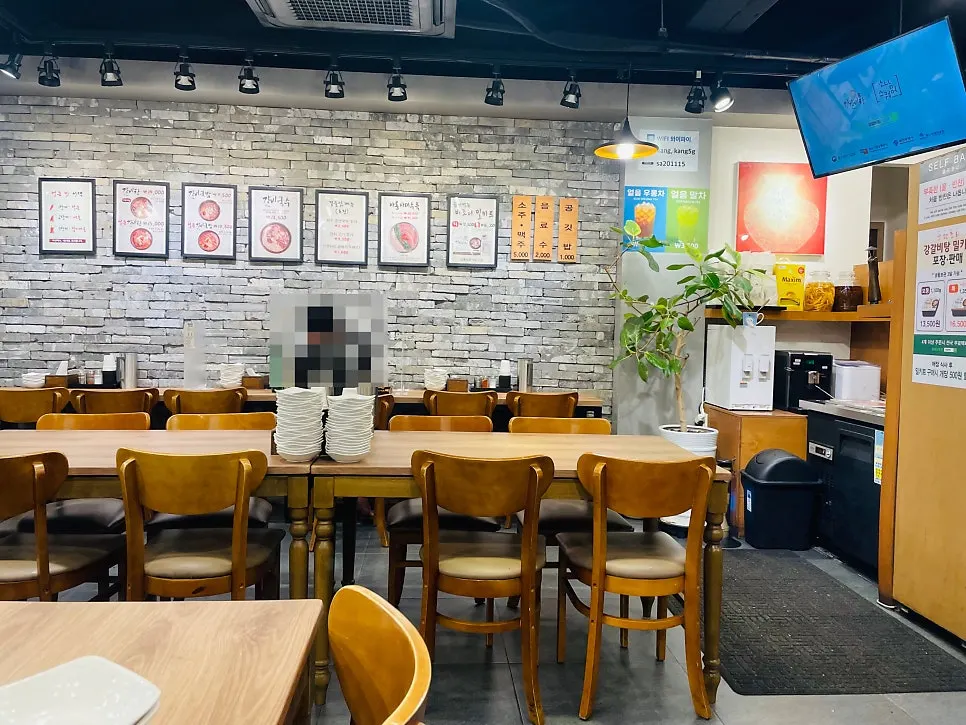 Tables and bar seating inside Gang Galbitang Seomyeon