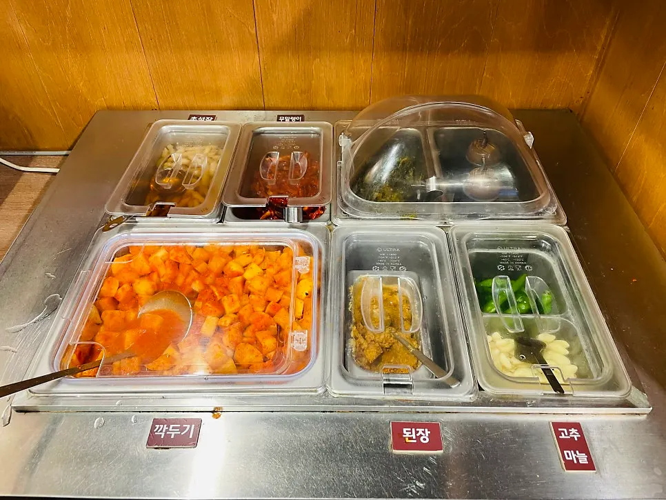 Self-serve side dish station at Gang Galbitang