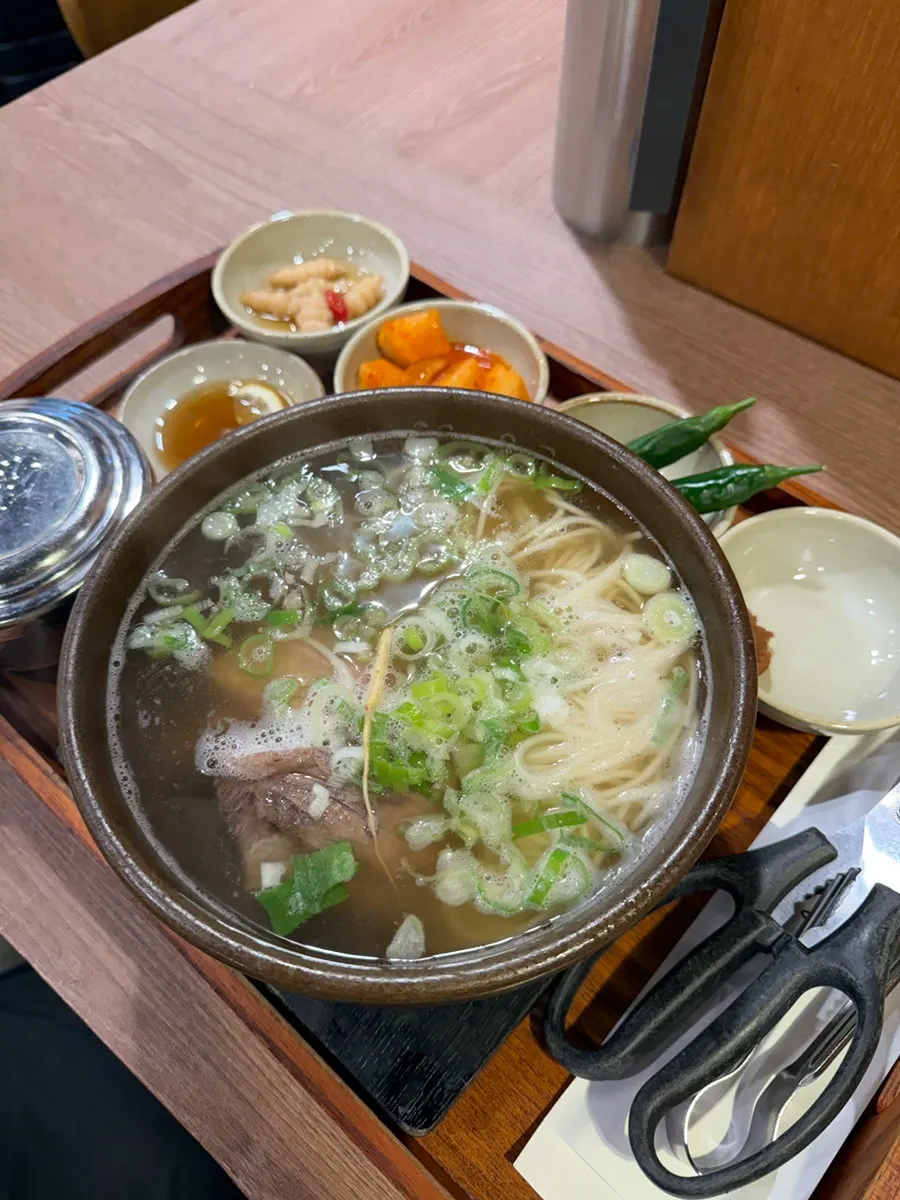 Galbitang topped with ginseng