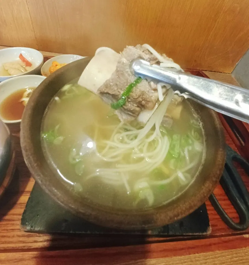 A large chunk of rib meat in the broth