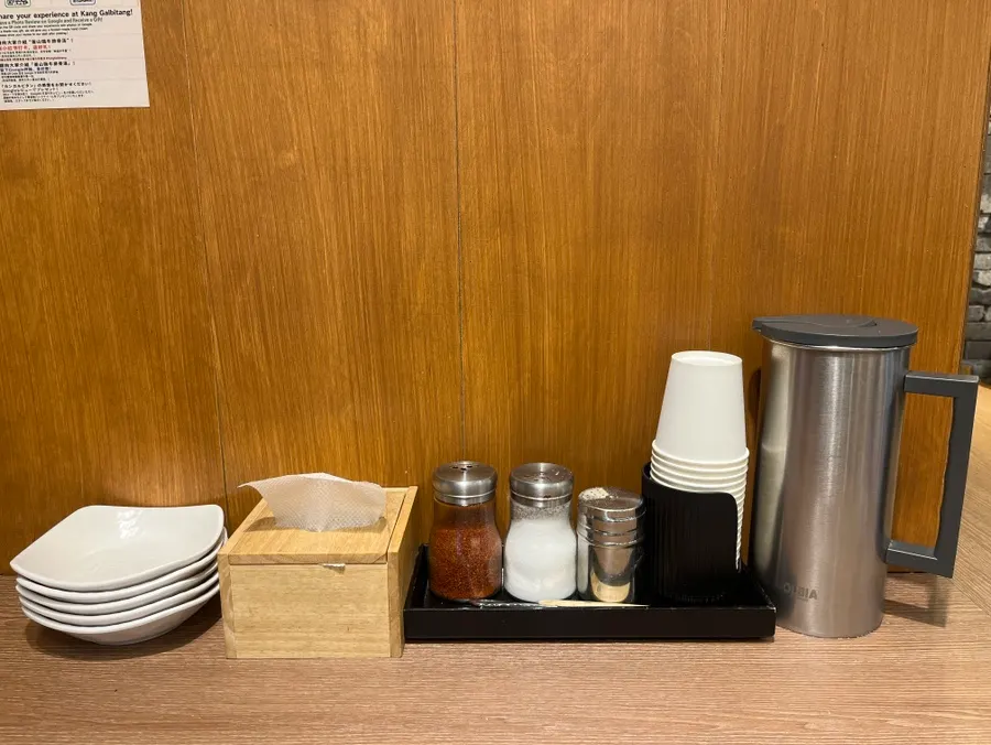 Seasonings and dining supplies in front of the table