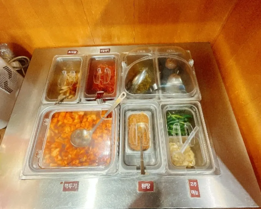 Self-bar side dish corner at Gang Galbitang Seomyeon
