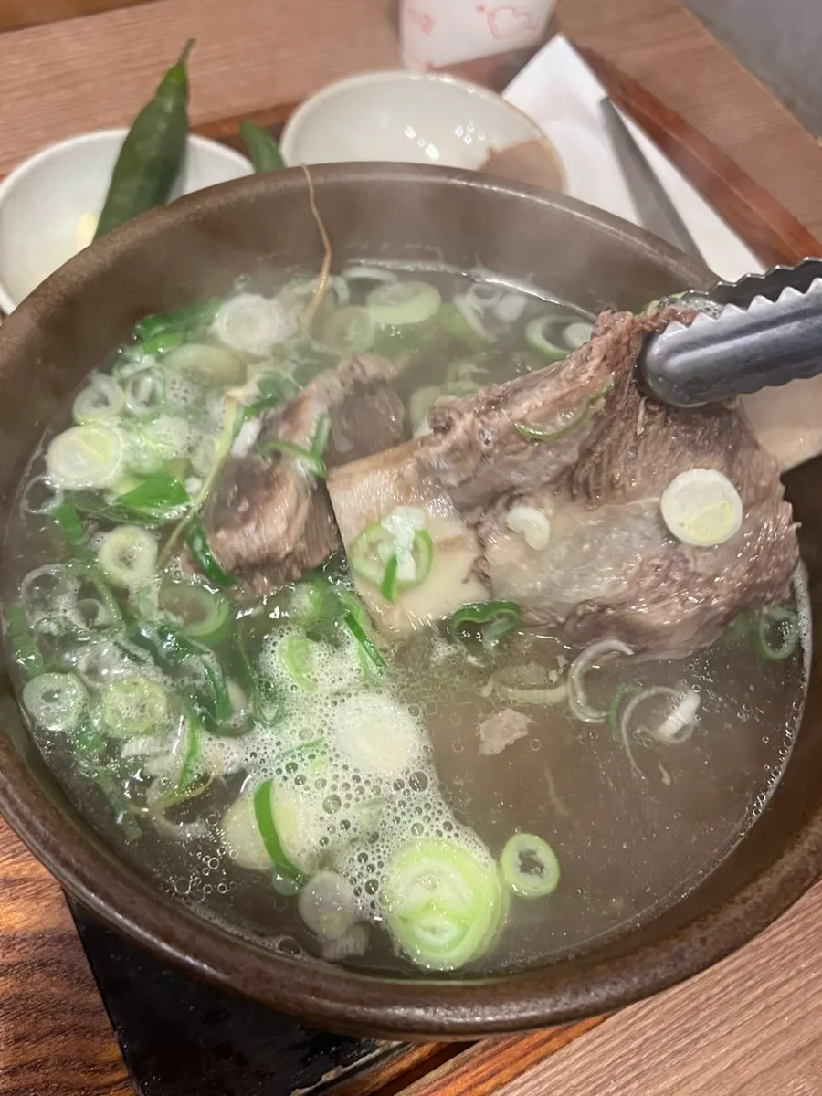 Big chunks of meat cut with scissors in the galbitang