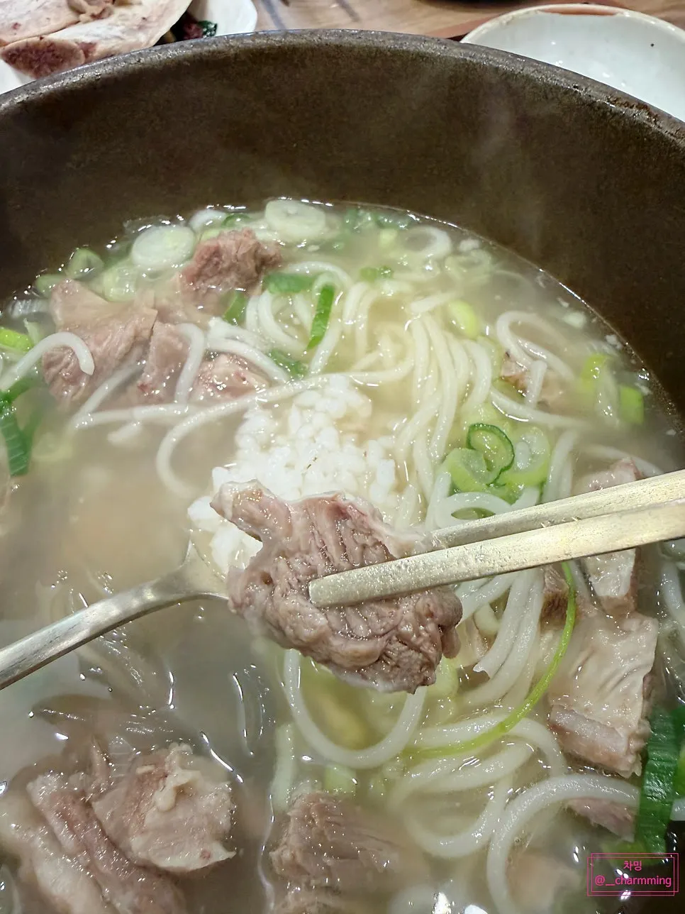 Three large rib bones in the broth