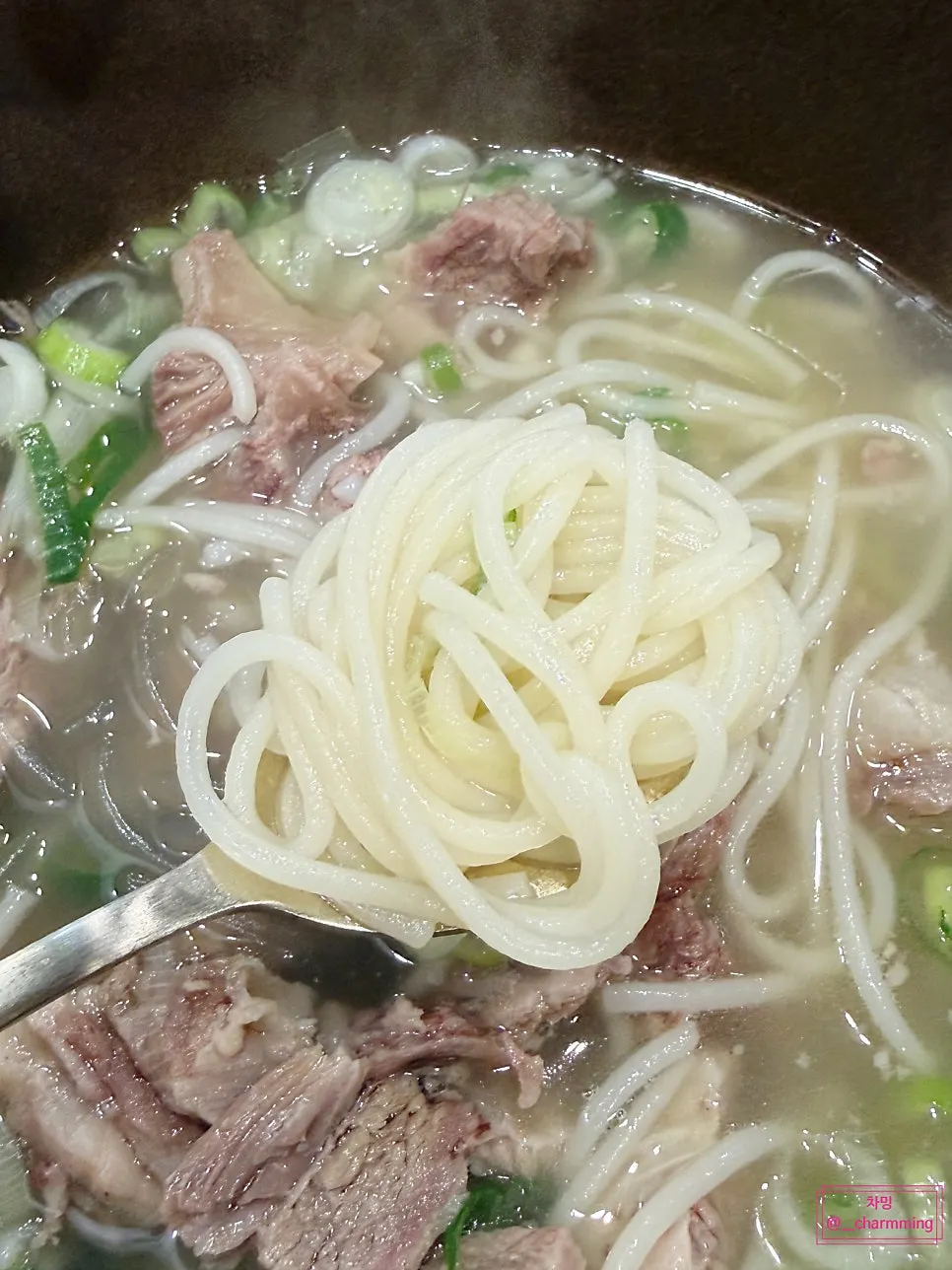 Jeju-shipped jungmyeon noodles lifted out of the bowl