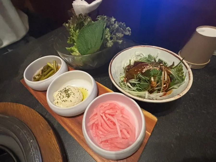 Wrap vegetables, green onion shreds, and potato salad side dishes