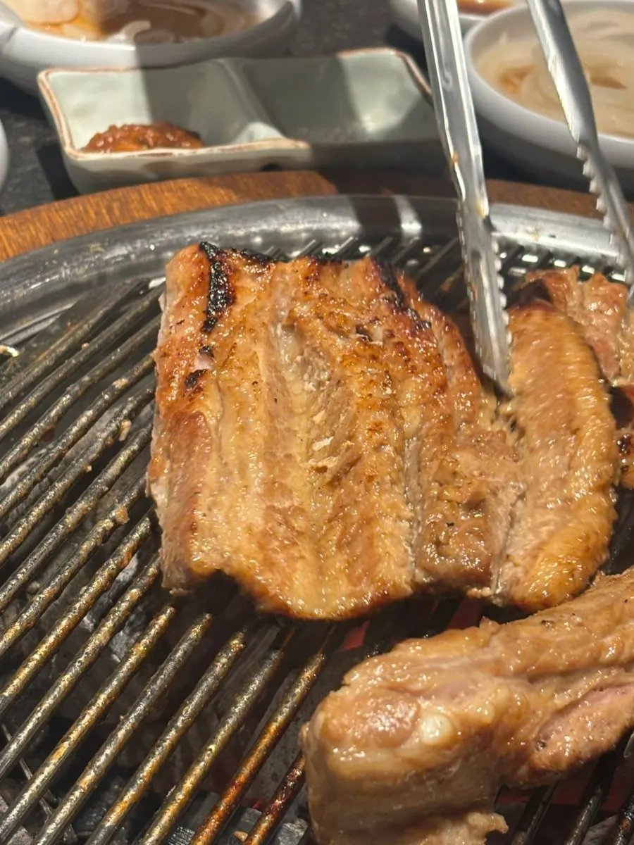Marinated ribs grilling on the fire