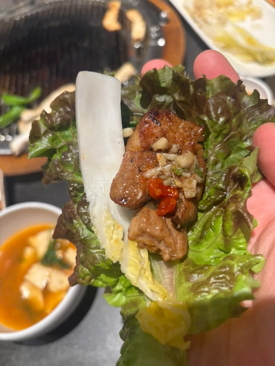 Marinated rib wrapped in a lettuce leaf