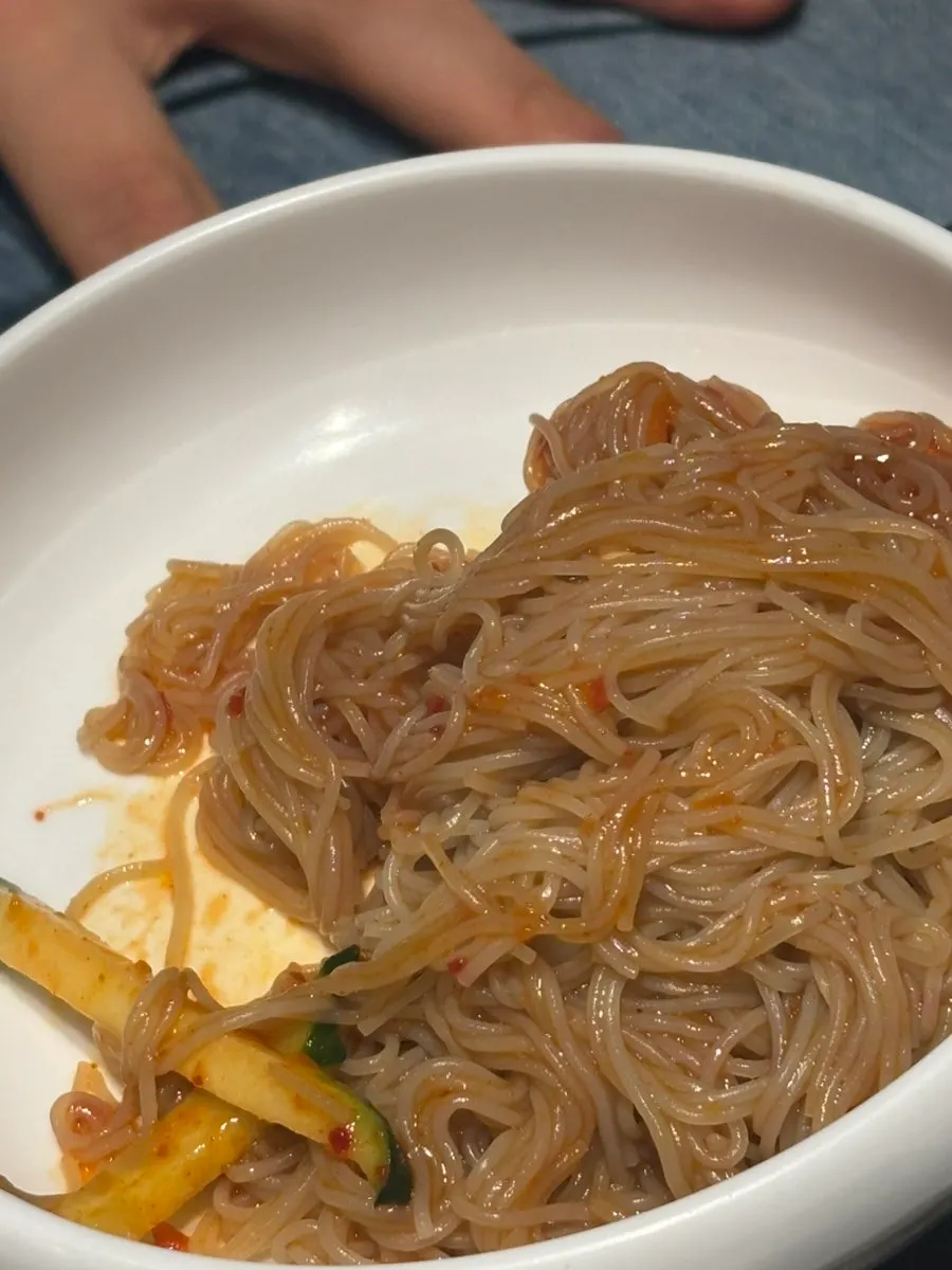 Half-and-half naengmyeon combining cold broth and mixed noodles