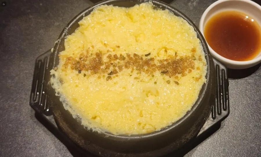 Hot egg soufflé served in a small bowl