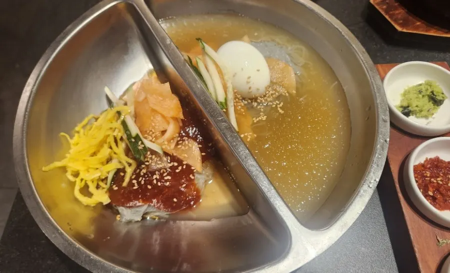 Half-and-half naengmyeon with bibim and mul noodles together